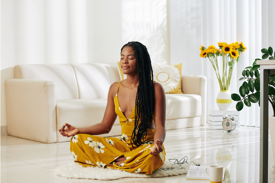 A woman engages in relaxation techniques for coping with stress     