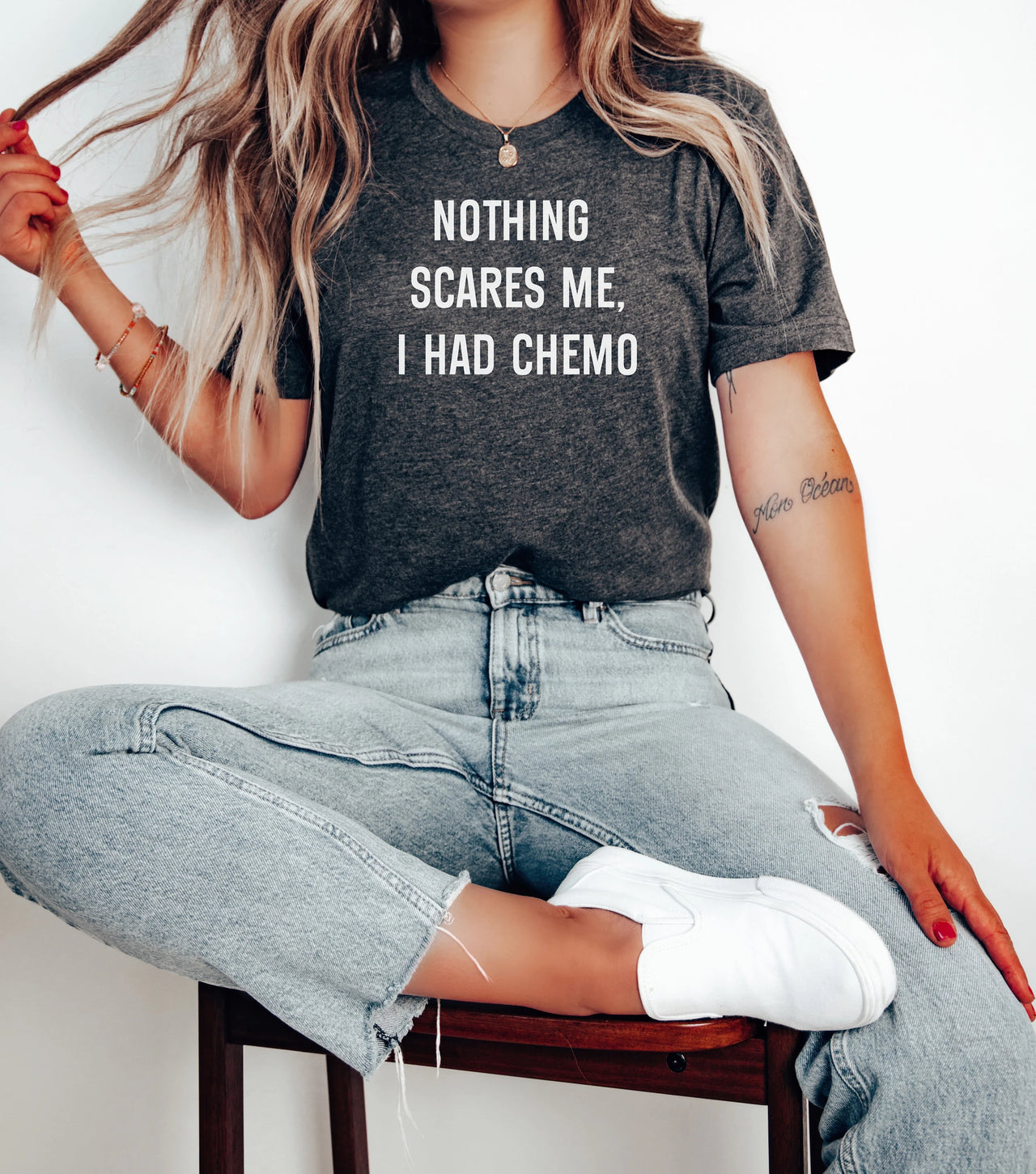 Woman modeling Nothing Scares Me Chemo shirt.